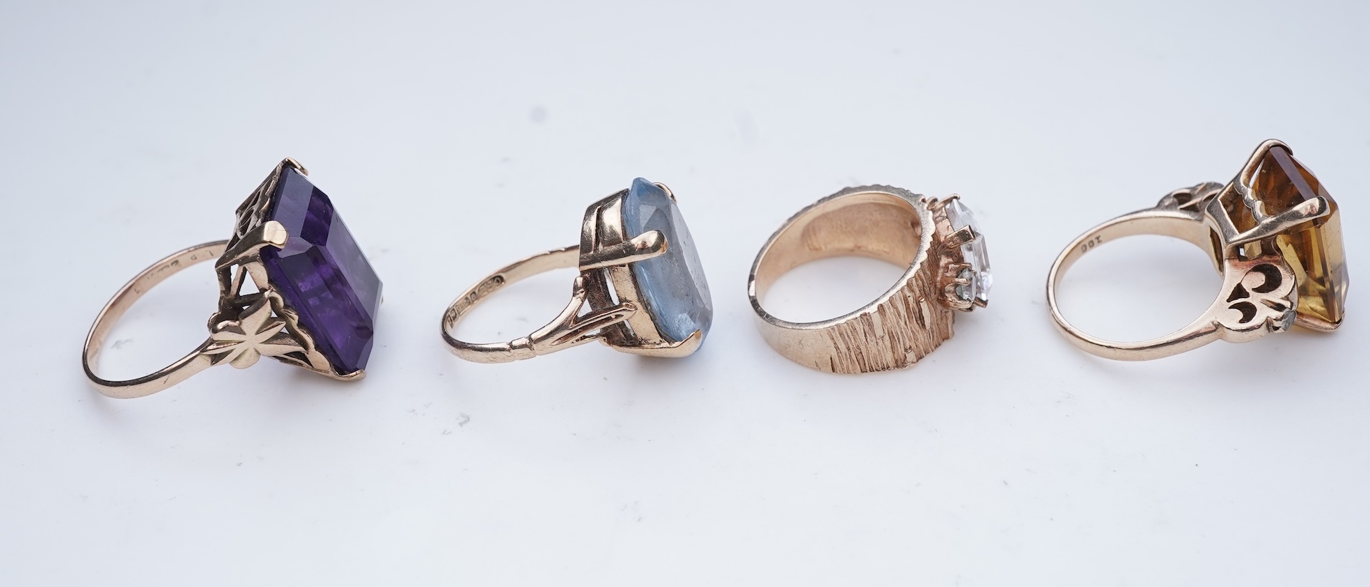 Four gem-set rings